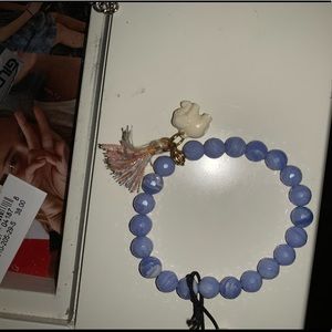 purple beaded bracelet with elephant charm